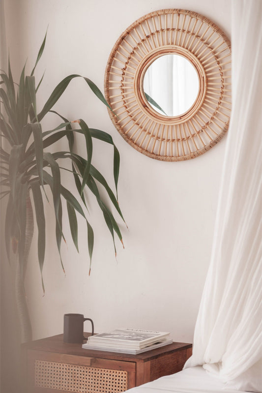 Imperfect Rattan Mirrors handmade by Village Thrive using natural materials.