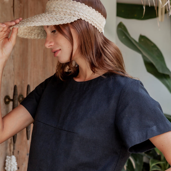 Rattan Sun Visor in Blonde handmade by Village Thrive using natural materials.